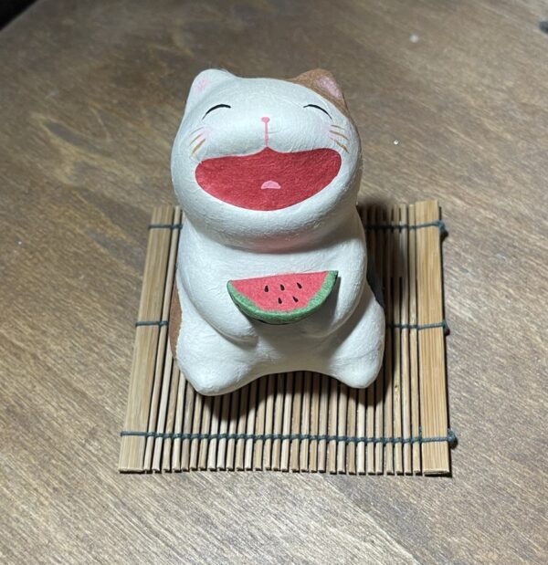 gatto sorridente con anguria